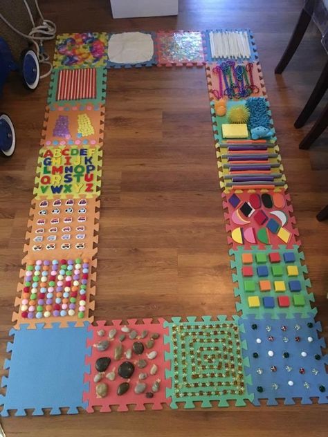 DIY sensory walk using foam puzzle tiles Sensory Walk, Vetenskapliga Experiment, Diy Sensory, Sensory Wall, Sensory Bag, Rainbow Rice, Baby Sensory Play, Sensory Rooms, Toddler Sensory