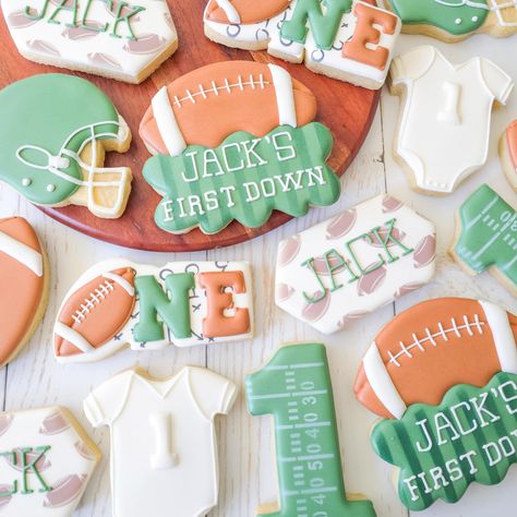 I am not big into sports but for some reason, I really like making sports-themed cookies🏈⚾️⚽️, especially when it’s for the little ones 👶🏻 First Year Down Football Birthday Cookies, 1st Year Down Birthday Theme, First Birthday Boy Sports Theme, First Birthday Sports Theme, Football Baby Shower Cookies, First Birthday Football Cookies, Football Sugar Cookies, Football First Birthday, Football Cookies