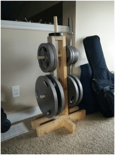 Here at DIY Active, we are all about getting fit at home but many people are worried that costs too much. But never fear! There are several ways you can create your own DIY equipment for almost nothing! Check out this economical DIY weight tree and how it can complement your squat rack! #DIY #DIYGym #fitness #exercise Weight Stand Diy, Weight Holder Rack Diy, Dumbell Stand Diy, Squat Rack Diy, Dumbell Rack Diy Wood, Diy Squat Rack Wood, Home Made Squat Rack, Weight Stand, Fitness Storage