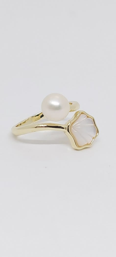 Freshwater WHITE  5mm Bottom Pearl and Mother of Pearl Shell Yellow Gold-Plated Ring. White Pearl Ring in yellow Gold Solid-Plated size 6.5. One size fit all / Adjustable Ring. Pearl and Shell Lover Ring. Product Info: -Stone: Freshwater Pearl / Mother of Pearl. -Pearl Size: 5mm -Pearl Color: White. -Metal: Yellow Gold-Plated. -Size 6.5 / One size fit all / Adjustable Ring -Nice Gift Box Included Luxury Gold Mother Of Pearl Rings, Pearl Ring 2022, Shell Jewelry Pearl, Luxury White Mother Of Pearl Ring, Luxury Gold Pearl Shell, Luxury Pearl Ring With Pearl Charm, Shell Rings, Ocean Ring, White Pearl Ring