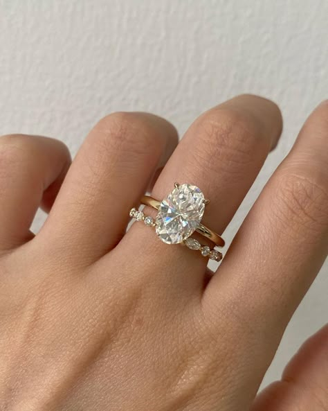 27 Oval Engagement Rings That Every Girl Dreams, Oval Cut Ring Stack, Oval Engagement Ring With Wedding Band Stack, Oval Solitaire Engagement Ring With Band, Oval Rings Engagement, Oval Ring Stack, Oval Wedding Ring Set Stack, Oval Engagement Ring Stack, Oval Engagement Ring Gold