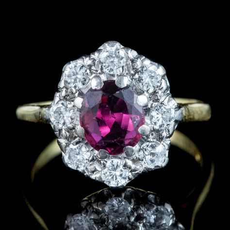 New in! A glorious antique Edwardian ruby and diamond cluster ring adorned with a natural oval-cut ruby in the centre with a deep cherry-pink hue. It weighs approx. 0.80ct and is complemented by eight bright diamonds, totalling approx. 0.80ct as well. The diamonds are all brilliant-cut, except one old mine-cut that may have been added over time. The piece is all 18ct with a white gold gallery and yellow gold back and band. It dates to the early-1900s and would make a stunning antique engage... Gold Gallery, Edwardian Engagement Ring, Antique Engagement Ring, Ruby Diamond Rings, Antique Engagement, Antique Engagement Rings, July Birthstone, Ruby Diamond, Diamond Cluster Ring