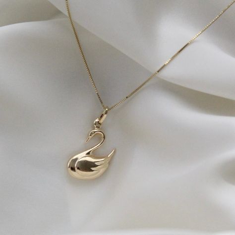 "14K Solid Gold Swan Necklace . . . * Pendants Measurements With Bail: (30 x 15 mm) * Chain is included ( 1MM Box Chain) * Stamp: Real 14k Gold * Never gold filled or plated * Hypoallergenic * Water Resistant * Scratch Resistant * Packaged With Free Gift Box . . . If you have any questions, just hit the \"Message the Seller\" button ( bottom right of the page) and we will get back to you within a few hours. . . . Mailed in a cute white package great for gifting. . . . Check our Social Media @Tal Swan Pendant Gold, Swan Jewelry Necklace, Swan Accessories, Cute Pendant Necklace, October Jewelry, Swan Jewelry, Swan Pendant, Gold Swan, Cute Necklaces