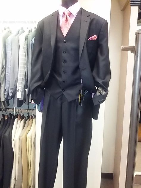 3 piece black Vitali suit with pink shirt and tie #birminghammenswear #mensfashion nuwearmen.com Two location in Birmingham Roebuck and Western Hills Mall Black Suit With Pink Accents Men, Black Suit With Pink Accents, Pink Tie Black Suit, Black Suit With Pink Tie, Black Suit Pink Tie, Black Suit Pink Shirt, Prom Suits For Men Black, Pink And Black Suit, Mens Prom Outfit