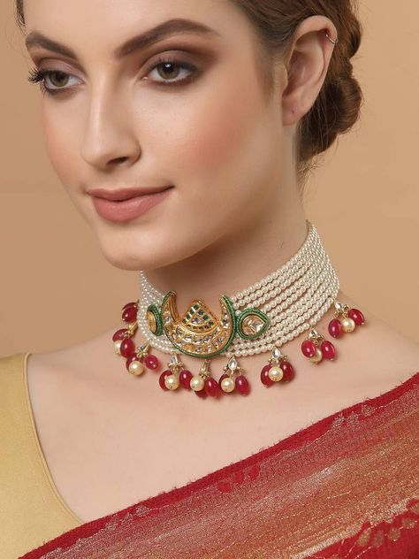 WHITE CHOKER NECKLACE WITH RED BEADS AND GREEN MOON DECORATED PENDANT Sabyasachi Jewellery Choker, Celebrity Necklace, Jewellery Choker, Choker Sets, Multi Layered Necklace, Gold Bracelet Simple, Sterling Silver Choker Necklace, Choker Necklace Designs, Sabyasachi Jewellery