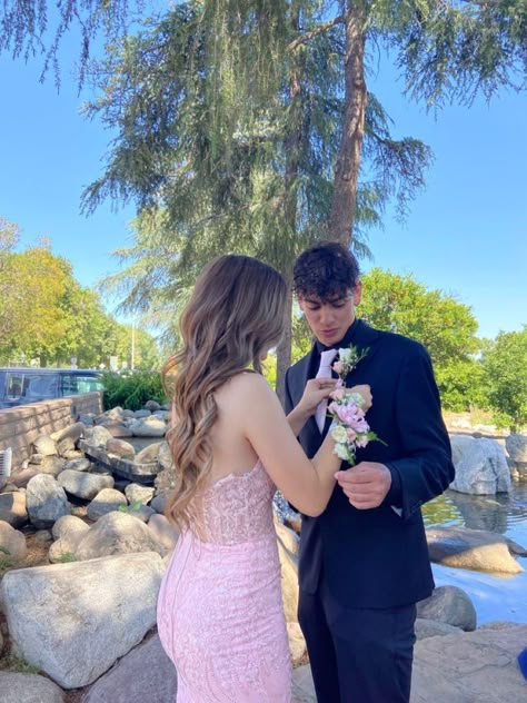 Light Pink Prom Couple Black, Pink Dress Matching Couple, Corsage With Pink Dress, Pink Hoco Dress With Date, Pink Prom Dress Couple Pictures, Pink Prom Looks For Guys, Pink Matching Prom Couples, Navy Blue And Pink Prom Couple, Black Suit Pink Tie Prom