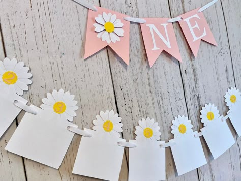 This anyoccasionbanners daisy themed first birthday high banner and or 12 month photo banner will be a super cute touch to your little ones big day! You can choose to get the word banner only or the 12 month banner only or get both items! The word banner is made with 4x5 inch light pink card stock 12 Month Banner, Daisy 1st Birthday, Daisy Photo, Groovy One, Daisy Party, Birthday Thanks, 1st Birthday Decorations, First Birthday Themes, First Birthday Decorations