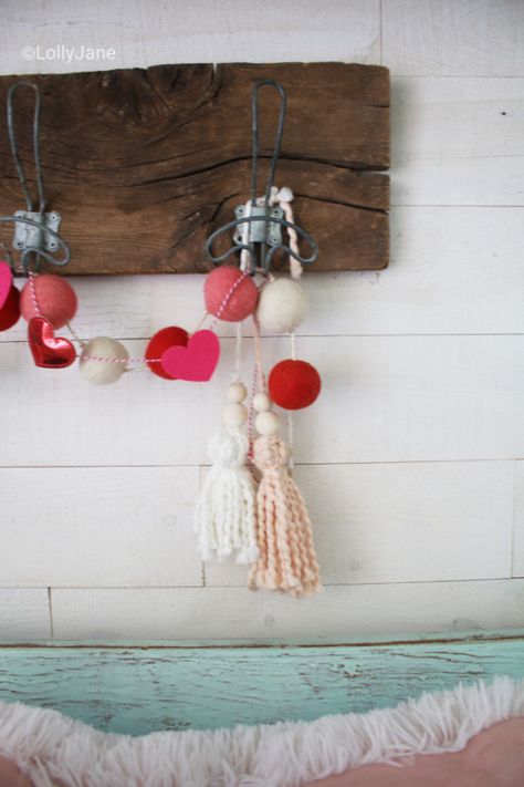 Such a cute yarn home decor neutral tassel for Valentine's Day! Love this pretty soft pink yarn tassel, the cutest Valentine's Day garland! #vintagevalentinesday #valentinesdaydecor #vdaydecor #vdaymantel #valentinesdaymantel #bluemasonjarcollection #pinkvaletinesdaydecor #pinkyarntassel #woodbeadtassel #valentinesdaygarland Valentine Tassels, Valentine’s Day Wall Decor, Valentines Yarn Wreath, Valentines Wreaths & Garlands, Tassel Ornament, Love Jar, Balloon Background, Wedding Balloon Decorations, Diy Valentines Decorations