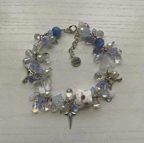 Silver And Blue Outfit, Blue Charm Bracelet, Cluttered Bracelets, Aesthetic Handmade Jewelry, Bead Organizing, Clutter Bracelet, Blue Bracelet Ideas, Beaded Bracelet Designs, Themed Bracelets