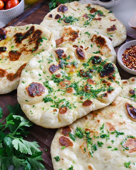 Fluffy, bubbly, chewy, and with a warm herby butter brushed on top! Homemade Naan Bread Easy, Easy Homemade Naan, Homemade Naan, Homemade Naan Bread, Baking Breads, Recipes With Naan Bread, Naan Recipe, Weeknight Dinner Recipes Easy, Flat Bread