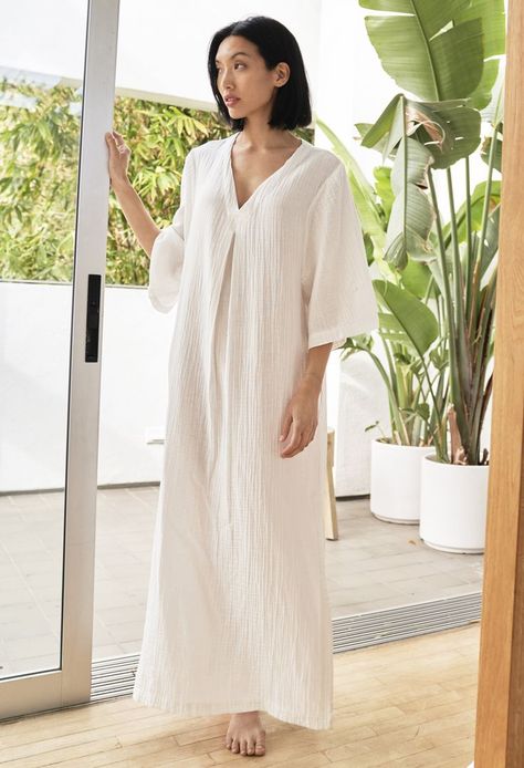 Eco friendly caftans and tunics inspired by the ocean, made on main street. Ethically sourced and locally made in Los Angeles. We had so many requests for a casual-just-out-of the-shower caftan that we took our favorite cotton gauze fabric and combined it with our best selling silhouette to create this super comfy Cotton Gauze Caftan. In white, this one is slightly sheer. Soft as a cloud, it features pockets (of course) a flattering v-neckline with a single invert pleat, and side slits at the he Gauze Maxi Dress, Cotton Gauze Fabric, Oversized Shirt Dress, Gauze Dress, By The Ocean, Kimono Sleeves, Gray Silk, Gauze Fabric, Kimono Sleeve