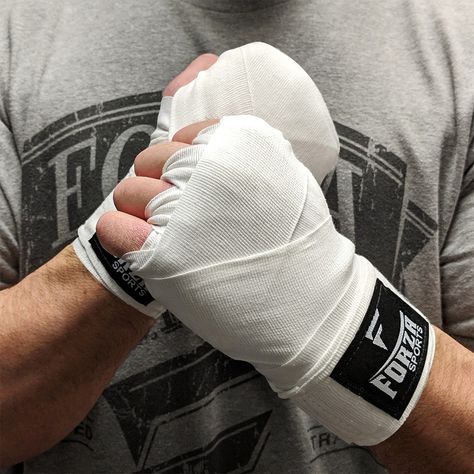 Protecting your hands while boxing or training is a necessity. The Forza Sports 120" Mexican Style Boxing and MMA Handwraps allow a tight fit that fits to the contour of your wrist while lending vital support to your fist. The wraps give you a long length of 120", or 3.05 meters, to safely wrap your hands and wrists while punching, striking and fighting your way to the to. Allow a secure and tight fit, while also lending vital support to your fist. 120" (3.05 meters) - gives you the length that Boxing Wraps, Jiu Jitsu Uniform, Boxing Hand Wraps, Triathlon Suit, Hand Wraps, Martial Arts Boxing, Boxing Shorts, Aikido, Columbia Blue