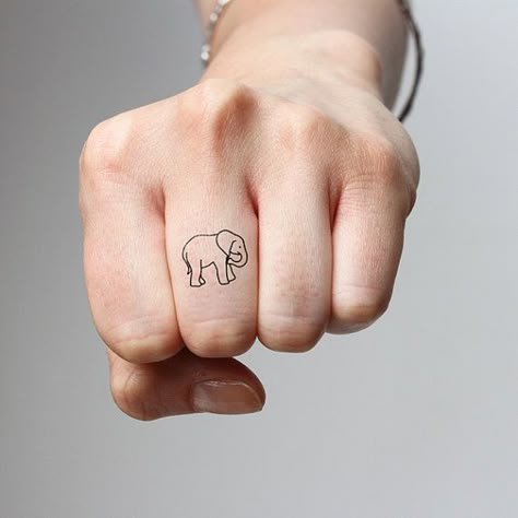 This tiny minimalist elephant tattoo — $2.99 | 23 Stylishly Clever Ways To Cover Your Body In Elephants Small Elephant Tattoo, Tiny Elephant Tattoo, Minimalist Tattoo Meaning, Typography Tattoo, Tattoo Diy, Elephant Tattoo Design, Hawaiian Tattoo, Small Elephant, Elephant Tattoo