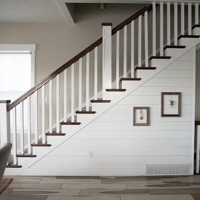 Our classic smooth shiplap will not only add elegance to any room, but by installing it horizontally you can make your room seem more spacious. Install it vertically and it will make your ceiling feel higher. This cabinet-grade shiplap gives your room a sophisticated modern look. Use white or almond for a light and airy feel, or gray for a dramatic accent wall. These panels are precision engineered to be easily installed. They are pre-finished so no need to sand or paint. And you can do it yours Shiplap Stairwell, Dramatic Accent Wall, Stairs Makeover Ideas, Farmhouse Stairs, Wood Wall Paneling, Stairs Renovation, Shiplap Wall Diy, Stairs Makeover, Stair Wall