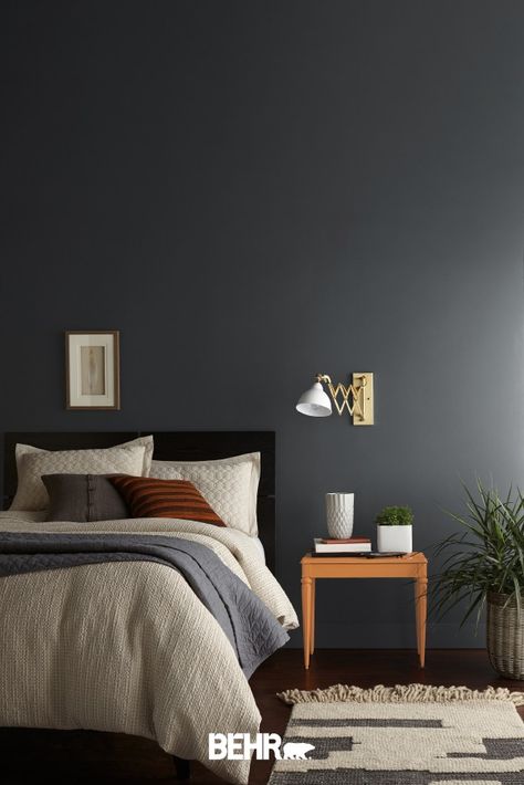 For your next DIY home makeover project, make the bold choice. The Behr paint Color of the Month, Graphic Charcoal, is the perfect place to start. It’s a dark, dramatic shade of gray that’s still neutral enough to integrate with a variety of colors and interior design styles. Click below for more color inspiration. Charcoal Gray Accent Wall, Accent Wall Office, Gray Accent Wall, Charcoal Bedroom, Dark Gray Bedroom, Bedroom Paint Colors Master, Charcoal Walls, Behr Colors, Grey Accent Wall