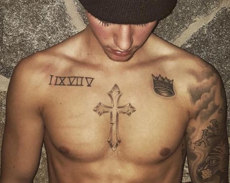 List of All Justin Bieber Tattoos With Meaning (2019) Justin Bieber Arm Tattoo, Chest Tattoo Roman Numerals, Chest Tattoo With Meaning, Arm Tattoos With Meaning, Justin Tattoo, Tiny Cross Tattoo, Christus Tattoo, Cruces Tattoo, Cross Tattoo Meaning