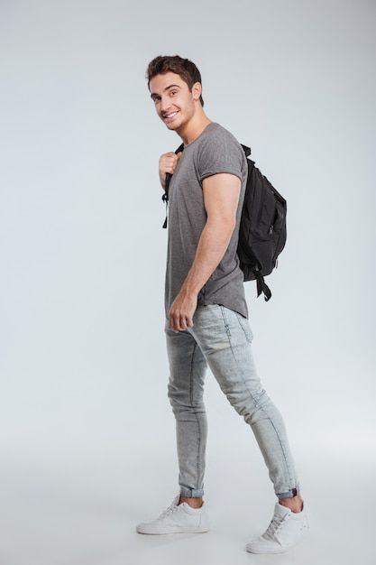 Photo full length portrait of a happy ca... | Premium Photo #Freepik #photo #cool-guy #guy #handsome #male-student Standing Pose, Swag Quotes, Casual Man, Character Sheets, Standing Poses, Male Poses, Model Poses, Bagpack, Vector Photo