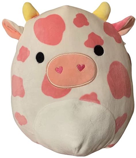 Evangelica the Cow is a pink and white Squishmallow from the Valentine Squad. Meet Evangelica. She is a huge animal lover and has a soft spot for animals in need. She works at a rescue farm where she takes care of animals of all kinds. She cooks for them and even reads them stories at night. Would you like to volunteer with her? Evangelica is a mostly white cow with a pattern of pink splotches. She has small, triangular yellow horns and round black eyes. She has a white left ear and a pink ... White Squishmallow, Rescue Farm, She Cooks, Cow Colour, Pillow Pals, Sea Cow, Cute Squishies, Pink Cow, Soft Spot