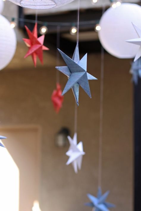 Easy DIY paper stars for the Fourth of July or any other holiday or party where you want simple and inexpensive hanging decorations. Hanging Stars Decorations, Stars Decorations, Hanging Origami, Diy Christmas Star, Paper Mache Christmas, Festive Recipes, Fourth Of July Decorations, Hanging Stars, Stars Craft