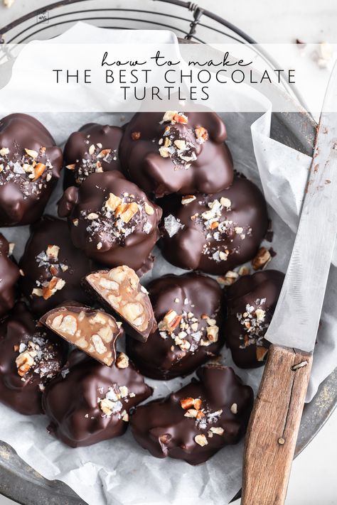 Learn how to make chocolate turtles from scratch. With a slow-cooked caramel, deeply toasted pecans, and a dip in perfectly tempered chocolate. Rich, gooey caramel, crunchy pecans and snappy chocolate. A thing of beauty! Follow me on Pinterest for more recipes like this! Almond Caramel Clusters, Dark Chocolate Turtles Recipe, Turtle Candy With Pecans And Caramel, Chocolate Turtles Recipe, Dark Chocolate Turtles, Pecan Turtles Recipe, Turtles Recipe, Chocolate Covered Pecans, Turtle Recipe