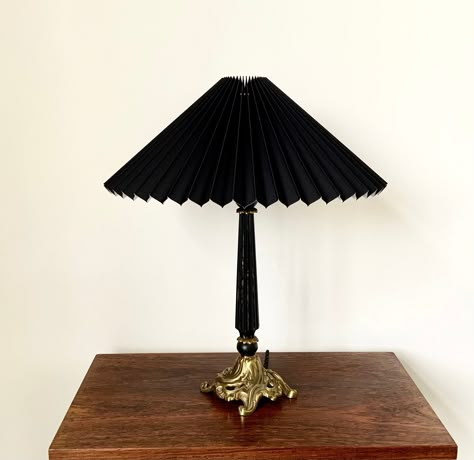 A Danish vintage, black lacquered wood and solid brass table lamp. It has a lovely art nouveau style design and comes with a new black chintz knife pleated lampshade. The lamp is in very good vintage condition with small signs of age and use including some loss of black lacquer (please see photos). The lamp comes with new black twisted fabric cable with integral on/off switch and new black light fitting.  Gorgeous period lighting! Height lamp without shade: 33 cm, 33" Height with shade approx: 4 Small Black Table Lamp, Brass Lamp With Black Shade, Pleated Table Lamp, Dark Vintage Decor, Lamp Without Shade, Small Table Lamps, Diy Table Lamp, Pleated Lampshade, Twisted Fabric