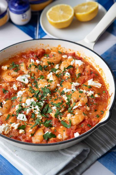 Shrimp Saganaki with feta and tomatoes is a quick and flavorful Greek dish that's perfect for a quick lunch or dinner. With shrimp, tangy feta, and a rich tomato sauce, it's both satisfying and easy to prepare. A simple one-pan recipe for those busy days where you're craving something flavorful. Shrimp Tomatoes Feta, Shrimp Saganaki Greek, Shrimp With Feta And Tomatoes, Feta Tomato Recipe, Greek Seafood Dishes, Shrimp And Feta Recipes, Tomato Feta Recipes, Greek Shrimp With Orzo And Feta, Shrimp Saganaki With Feta