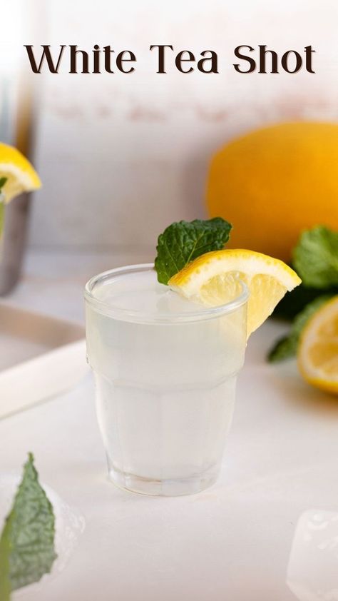 white tea shot in shot glass garnished with mint and lemon. White Tea Shot Recipe, White Party Foods, Shots Alcohol Recipes, Tea Cocktail Recipes, Fruity Alcohol Drinks, Tea Drink Recipes, White Drinks, Coctails Recipes, Cocktail Shots