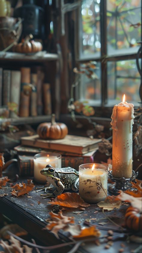 A frog, books and candles on the witch's table Witch's Table, Witches Lair, Witch Hut, Witch Potion, Herbal Magic For Wiccans, Witch Party, Fortune Telling Cards, Burning Candles, Halloween Table