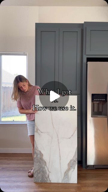 Valeria Jacobs on Instagram: "What I Got vs. How We Used It: Kitchen Reveal!  My SIL loves the look of marble, but not the maintenance or the price tag. So, when I found this gorgeous large format tile from @thetileshop, I knew it would be the perfect alternative for the backsplash. #thetileshoppartner Compared to the thousands a marble slab would cost, we spent under $600 on tile, and it perfectly completed the vision we had for this space.  The key to this project was getting a couple of extra boxes so we had enough tile to work with. We started by laying all the tiles out on the floor like a big puzzle, carefully matching the pattern as closely as possible for a seamless look. While this kitchen is full of DIYs, we decided to hire professional tile installers due to timing. However, wit Kitchen Marble Tile Backsplash, Large Marble Tile Backsplash Kitchen, Kitchen Backsplash Big Tiles, Large Tiles Backsplash, Kitchen Backsplash Large Tile, 12x24 Tile Backsplash Kitchen, Large Tile Kitchen Countertops, Large Format Tile Countertop, Tiles Laying Pattern