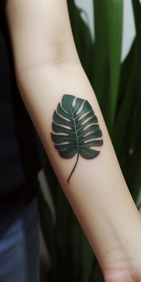 An enchanting small monstera leaf hand tattoo, featuring refined shading and lifelike lines in a striking design, exuding a sense of natural beauty. This delightful design showcases the elegance of nature, making it a perfect choice for those seeking a meaningful and artistic representation of their appreciation for the natural world on their hand. Monstera Leaf Tattoo, Hand Tatto, Leaf Tattoo, Plant Tattoo, Latest Tattoos, Face Tattoos, Tattoo Trends, Monstera Leaf, Geometric Art