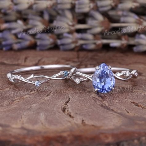 Wedding Rings Sapphire Silver, Blue Wedding Rings Sets, Unique Sapphire Wedding Rings, Harry Potter Inspired Engagement Rings, Nature Inspired Engagement Rings Unique, Bookish Engagement Ring, Engagement Rings With Blue Stones, Lotr Inspired Engagement Rings, Unique Engagement Ring Sets