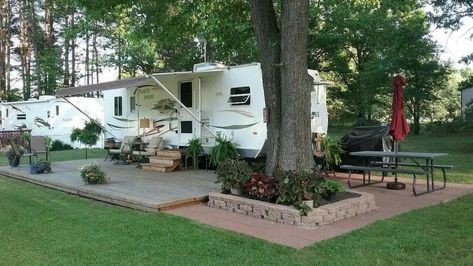 Backyard Camper Retreat, Trailer Patio Ideas Outdoor Spaces, Permanent Camper Site Ideas Camping, Rv Lot Landscaping Ideas Patio, Permanent Camper Site Ideas Patio, Campsite Landscaping Ideas, Rv Landscaping Ideas, Seasonal Camping Sites Ideas, Campground Decorating Outdoor