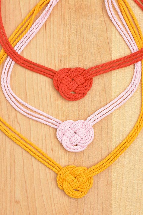 This macrame necklace is SO PRETTY! It's such a great DIY jewelry craft that both kids and adults will love. Make a braided necklace, or a Celtic heart necklace. Both of these macrame necklace patterns are perfect for beginners. All you need is 15 minutes and some macrame cord! Such a fun and easy macrame craft idea! Simple Macrame Necklace, Braided Necklace Diy, Macrame Choker Diy, Macrame Necklaces With Round Beads As Gift, Adjustable Macrame Beaded Necklace For Gifts, Macrame Necklace With Waxed Cord As A Gift, Diy Macrame Choker Necklace Tutorial, Diy Macrame Necklace, Gift Amulet Style Macrame Necklace