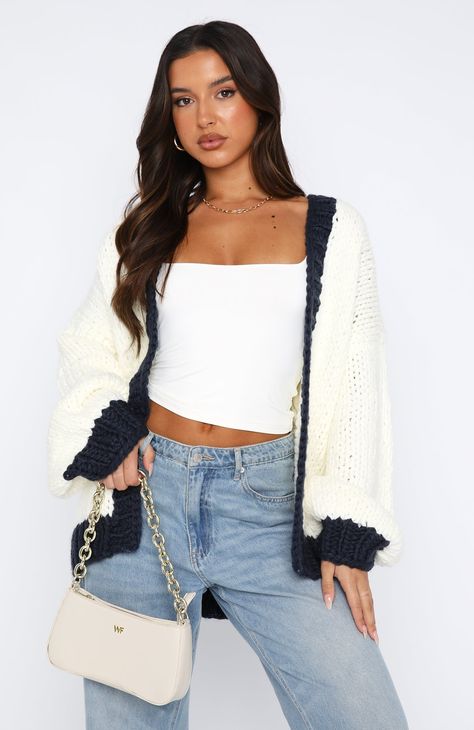 The A Little Too Much Knit Cardigan Cream + Navy. Head online and shop this season's latest styles at White Fox. Express delivery and AfterPay available. Outfits Fall/winter, Fall And Winter Clothes, Where To Get Cute Sweaters, How To Style Cream Jeans, White Sweater And Jeans Outfit, Winter Going Out, Jeans Christmas Outfit, College Fashion Outfits, Aerie Fits