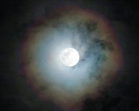 A circular rainbow around the Moon, also known as a Moonbow, lunar halo, or lunar rainbow, is sometimes caused by the refraction of light through ice particles in high altitude clouds.  It generally means rain or snow will fall shortly.  In a number of cases it's actually Cloud, Rainbow, and sometim Mirror Spell, Moon Close Up, Lunar Halo, Moon Meaning, Moon Rainbow, Refraction Of Light, Moon Logo, Moon Photos, Supernatural Beings