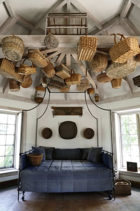 Single-object decorating is always effective, especially in Mrs. Mellon’s houses. A French steel-campaign tester bed, shown here with baskets hanging from the ceiling, was in Oak Spring Farm, and is for sale. Photo: Courtesy of Sotheby’s Bunny Homes, Bunny Mellon, Basket Lighting, Basket Case, Ceiling Decor, Basket Decoration, Hanging Baskets, The Ceiling, Valance Curtains