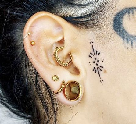 Front Of The Ear Tattoo Ideas, Boho Face Tattoos, Behind Ear Women Tattoo, Subtle Face Tattoos For Women, Side Ear Tattoo Women, Front Ear Tattoo Women, Small Face Tattoos For Women By Ear, Small Sideburn Tattoo Women, Small Forehead Tattoo