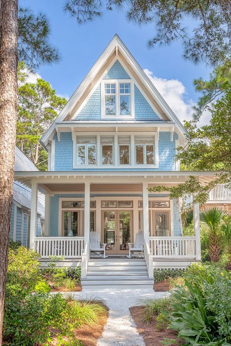 Transform your lifestyle with coastal retreats in classic American beach homes. Experience serene living with open spaces, natural light, and breezy decor that embraces relaxation and joy by the sea. Explore more design ideas!   #CoastalRetreats #BeachHomeDesign #AmericanArchitecture #ModernFarmhouse #HomeInspiration #InteriorDesign #LuxuryLiving #BeachHouseIdeas #CoastalDecor #DreamHomes #SustainableDesign #OpenConcept #HomeVibes #DesignTrends #NauticalInteriors Rural Beach House, Small Coastal House Exterior, Coastal Southern Decor, Light Blue Beach House, Elevated Coastal Homes, Beach House Hamptons, Luxury Beach House Interior, Southern Beach House, Beach House Exterior Colors