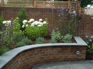 Brick built raised beds. Driveway Raised Beds, Garden Raised Border Ideas, Patio With Raised Beds, Raised Flower Bed Ideas, Brick Raised Garden Beds, Brick Raised Beds, Brick Flower Bed, Brick Wall Gardens, Brick Planter