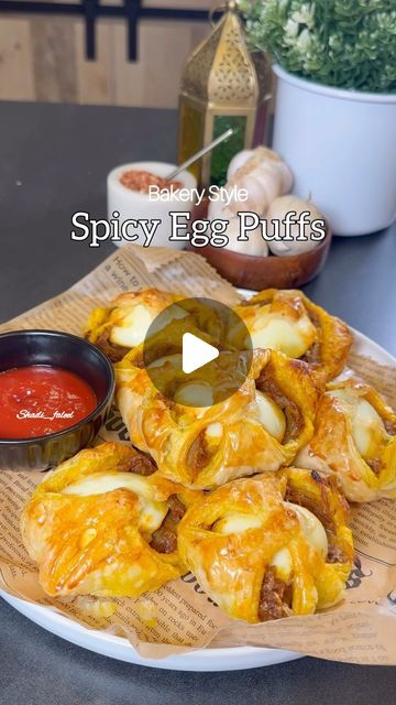 Fathima Yusuf (Shadiya) on Instagram: "Save this !! Ramadan series Episode:12  Spicy Bakery Style Egg Puffs !!  A savory delight for any time of the day & a nostalgic recipe which is has so many good memories having it fresh from the bakery every morning before leaving for school. It’s spicy slightly sweet and has everything you need in a flaky puff..   LIKE, SAVE, SHARE the reel & FOLLOW @shadi_faleel for more easy recipes.  You’ll need 5 eggs hard boiled and cut into halves  1/3 cup Oil 4 Sliced red onions  4 cloves of Chopped Garlic  1 tsp Salt or slightly more according to your taste  1 tsp Turmeric powder  1 tsp Cumin powder  1 tsp Red chilli powder  2 tsp Chilli flakes 1 tsp Kashmiri chilli powder (optional) 1 & 1/2 tbsp Sugar Juice of half a Lime Few Curry leaves (optional )  One eg Egg Puffs Recipe, Egg Puff Recipe Indian, Quick Snacks Easy Indian, Egg Puff Recipe, Ramadan Series, Kashmiri Chilli, Egg Puff, Spicy Eggs, How To Make Eggs