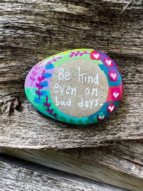 Unique Hand-Painted Rock: Spreading Joy, One Stone at a Time 🎨 Spread positivity and kindness with this beautifully hand-painted rock featuring the heartwarming message: "Be kind even on bad days." This unique piece of art is designed to remind us to maintain kindness and compassion, no matter the circumstances. The rock is adorned with colorful patterns and delicate floral designs, making it a perfect gift or a lovely addition to your personal space. Why Choose My Painted Stone? UV-Resistant Finish: This rock is protected with multiple coats of clear, UV-resistant enamel gloss for enduring beauty. Variety of Sizes and Shapes: Each stone is unique, ranging from 1.5 to 5.5 inches, ensuring you find the perfect piece. Made with Love: From design to shipping, I, Holly Bowers, handle every st Positivity Rocks, Rock Projects, I Got A Rock, Rock Quotes, Kindness And Compassion, Garden Rock Art, Candle Crafts Diy, Stone Art Painting, Painted Rocks Kids