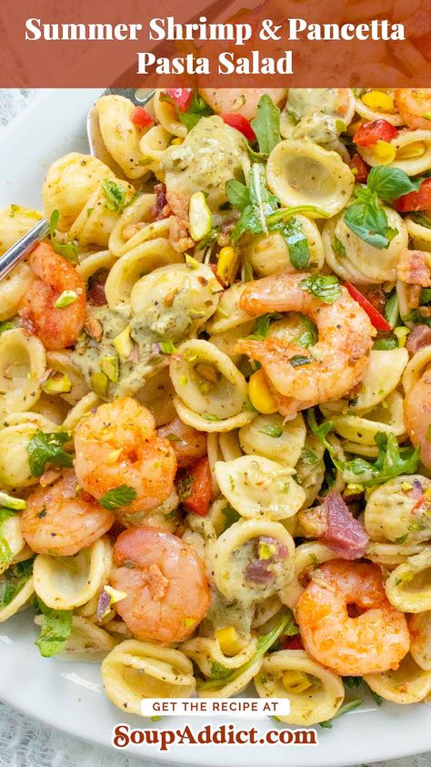 This could become your new favorite summer dish: the Summer Shrimp & Pancetta Pasta Salad! This cold and carby pasta dish features crispy pancetta, zesty seasoned shrimp, and a lush creamy pesto dressing, all tossed with fresh veggies and herbs. It's perfect for picnics, potlucks, or any festive outdoor gathering. Pin this for a vibrant, tasty addition to your summer recipe collection, and get the recipe at SoupAddict.com! Prawn Pasta Salad Cold, Summer Shrimp Pasta, Creamy Pesto Dressing, Summer Shrimp, Seasoned Shrimp, Shrimp Pasta Salad, Crispy Pancetta, Pancetta Pasta, Pesto Dressing