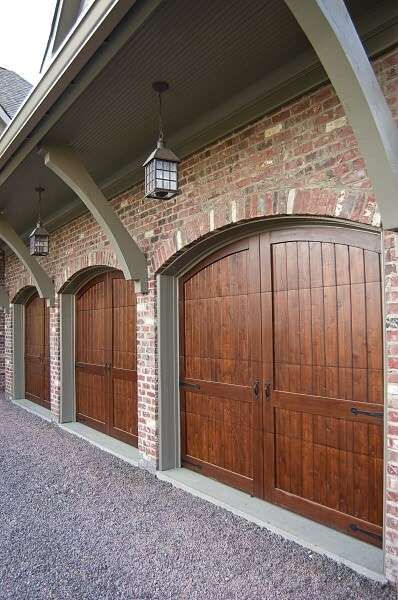 A concrete garage apron is an important feature of a driveway and garage as it provides a gradual slope into the garage, allowing your car to enter without damage and providing visual distinction between the driveway and garage. Garage Apron, Custom Wood Garage Doors, Garage Door House, Craftsman Garage Door, Garage Door Windows, Wooden Garage Doors, Wood Garage, Sectional Garage Doors, Modern Garage Doors