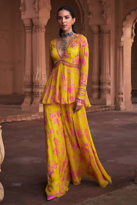 Shop for these amazing collections of Yellow Georgette Printed Floral Deep V Neck Peplum Top And Sharara Set For Women by DiyaRajvvir online at Aza Fashions. Indian Wedding Kurtis For Women, Georgette Sharara Suits, Ethnic Tops For Jeans, Floral Sharara Suit, Floral Print Dress Indian, Ring Ceremony Dress Indian, Haldi Outfits For Bridesmaid, Haldi Outfit Bridesmaid, Pink And Yellow Outfit