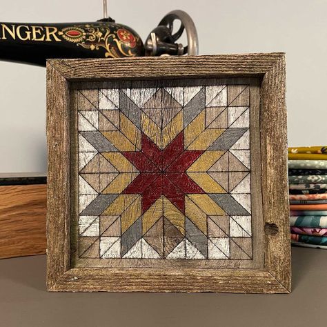 "Put this adorable little wooden quilt block in your sewing room, living room, favorite shelf -- anywhere! Made from reclaimed pine, the quilt block design is lasered onto the wood, then hand painted with acrylic paints. The 1 inch frame made from the same reclaimed wood allows the quilt block to easily sit on a shelf. Dimensions: approx. 6.5\" x 6.5\" x 1\" deep frame Paint Colors: white, gray, red and gold. Colors and wood grain/texture will vary slightly from photos shown as each unique quilt block is created and painted upon order. Please allow approx. 2 weeks for this item to be custom made and shipped out to you." Paint Colors White, Wood Quilt Block, Wooden Quilt, Wood Quilt, Quilt Pattern Book, Painted Barn Quilts, Barn Quilt Designs, Wood Wall Art Diy, Barn Quilt Patterns