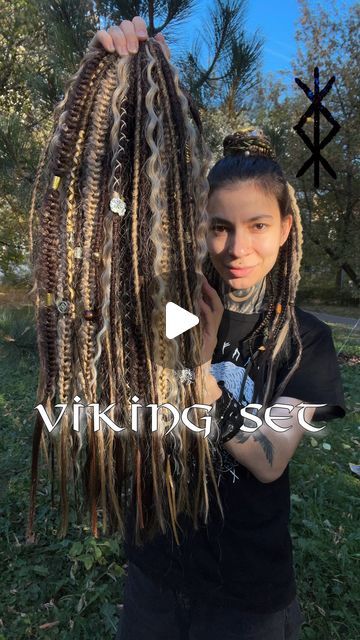 BasiliskHairs ⭐️ DREADS extensions on Instagram: "Natural looking Viking set ⚔️ READY TO SHIP Order online - BasiliskHairs.com, section “Ready to Ship”  Hybrid Locks (Curls), Dreads, various Braids, beads and jewelry! Decorated with lots of charms and beads, Aegishjalmur (Helm of Awe), Yggdrasil (tree of life 🌳), Mjolnir (Thor’s Hammer), Huginn and Muninn (Raven 🐦‍⬛), Fenrir (Wolf 🐺), runes, pagan ornaments, pagan sun, cuffs and rings, various ribbons and wraps!  VIDEO: Texture of dreads in set – crochet with straight ends; Type and quantity – full set, 80 single; Length – below the waist (23-26 inches).  🌍 worldwide shipping  WE ARE OPEN FOR CUST ORDERS #basiliskhairs  TAGS •••••••••• #paganwitch #forestwitch #blondedreads #syntheticdreads #syntheticdreadlocks  #witchfashion #dreadwit Braid In Dreads Extensions, Viking Dreads Women, Partial Dreads Placement, Older Woman Dreadlocks, Pagan Ornaments, Braids Beads, Partial Dreads, Fenrir Wolf, Dreads Extensions