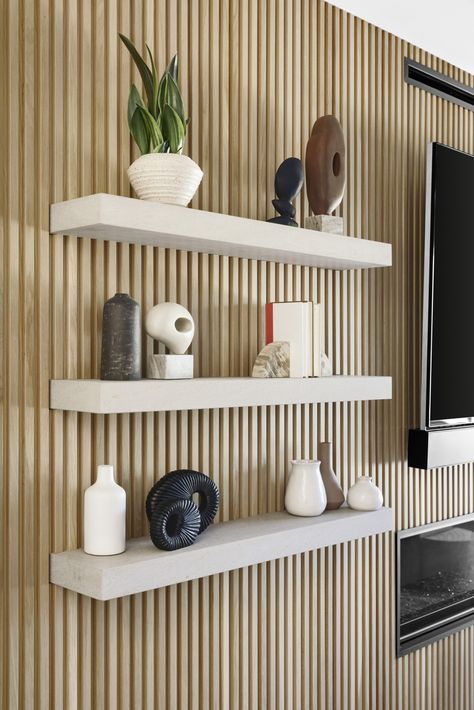 Fluted Wall With Shelves, Living Room Cladding Wall, Floating Wall Panels, Wood Slat Wall With Floating Shelves, Slat Wall Floating Shelves, Wall Panelling With Shelves, Shelves On Slat Wall, Wall Slats With Shelves, Wood Wall Slats Interiors