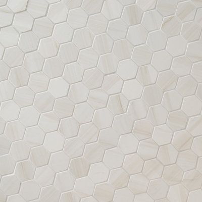 MSI's Eden Dolomite 12 in x 12 in. porcelain tile features soft dove gray tones with subtle veining and matte finish for an affordable luxury look. This tile features 2 in. hexagon chips on a 12 in. x 12 in. mesh-mounted mosaic sheet with a smooth finish and can be used for whole floors or wall sections or trimmed to provide a striking accent as desired. Use the tile in various areas around the home for medium-duty flooring such as in kitchens, hallways or even outside around terraces or balconi Hexagon Bathroom, Tile For Floor, Hex Tile, Tile Saw, Shower Surround, Hexagon Tiles, Bathroom Floor Tiles, Commercial Flooring, Porcelain Mosaic