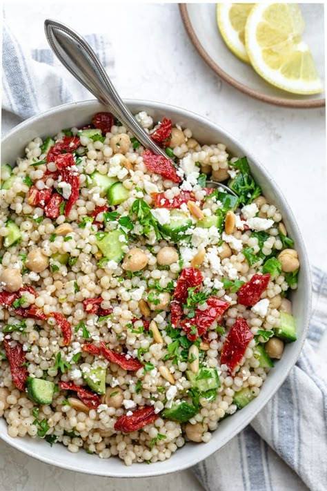 Mediterranean Couscous Salad is a fresh and healthy vegetarian summer recipe that is loaded with protein from the chickpeas and full of colorful vegetables. | Israeli couscous | Side Dishes | Vegetarian Recipes | Mediterranean diet | picnic recipes #couscoussalad #mediterraneansalad #mediterraneandiet #couscous #vegetarianrecipes #feelgoodfoodie Couscous Mediterranean, Salad Couscous, Salad Mediterranean, Mediterranean Couscous Salad, Mediterranean Couscous, Recipes Sides, Couscous Salat, Couscous Recipes, Summer Veggies