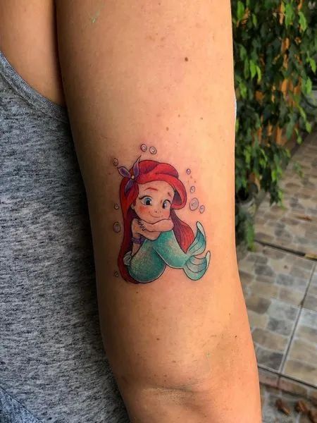 Mermaid Tattoo On Thigh, Small Ariel Tattoo, Cute Mermaid Tattoo, Baby Mermaid Tattoo, Mermaid Anchor Tattoo, Mermaid Thigh Tattoo, Mermaid Tattoo Ideas, Mermaid Tail Tattoo, Mermaid Tattoo Meaning